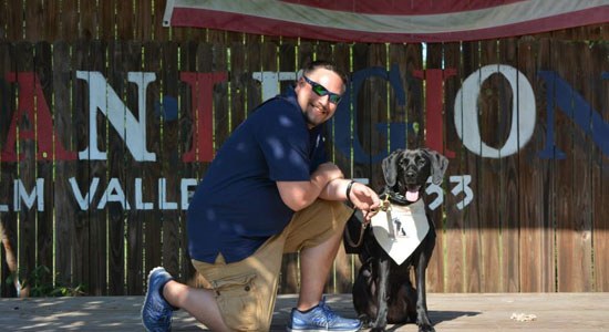  Bryan Foltz and his dog Dell at the K9s for Warriors graduation