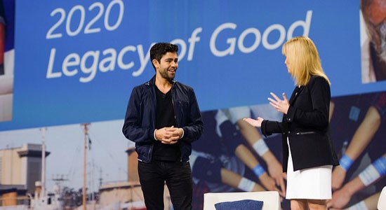Dell Social Good Advocate Adrian Grenier and CMO Karen Quintos on stage discussing Dell's Legacy of Good