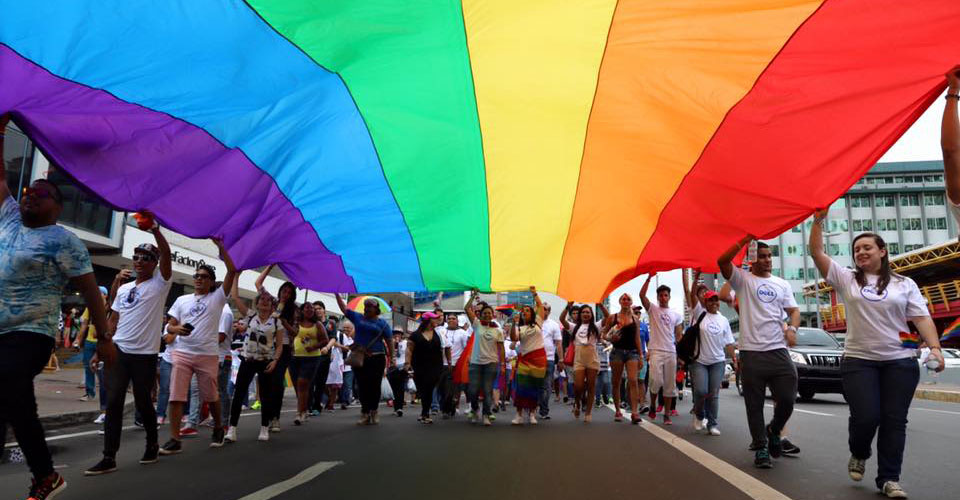 Dell Panama employees march in pride parade with rainbow flag